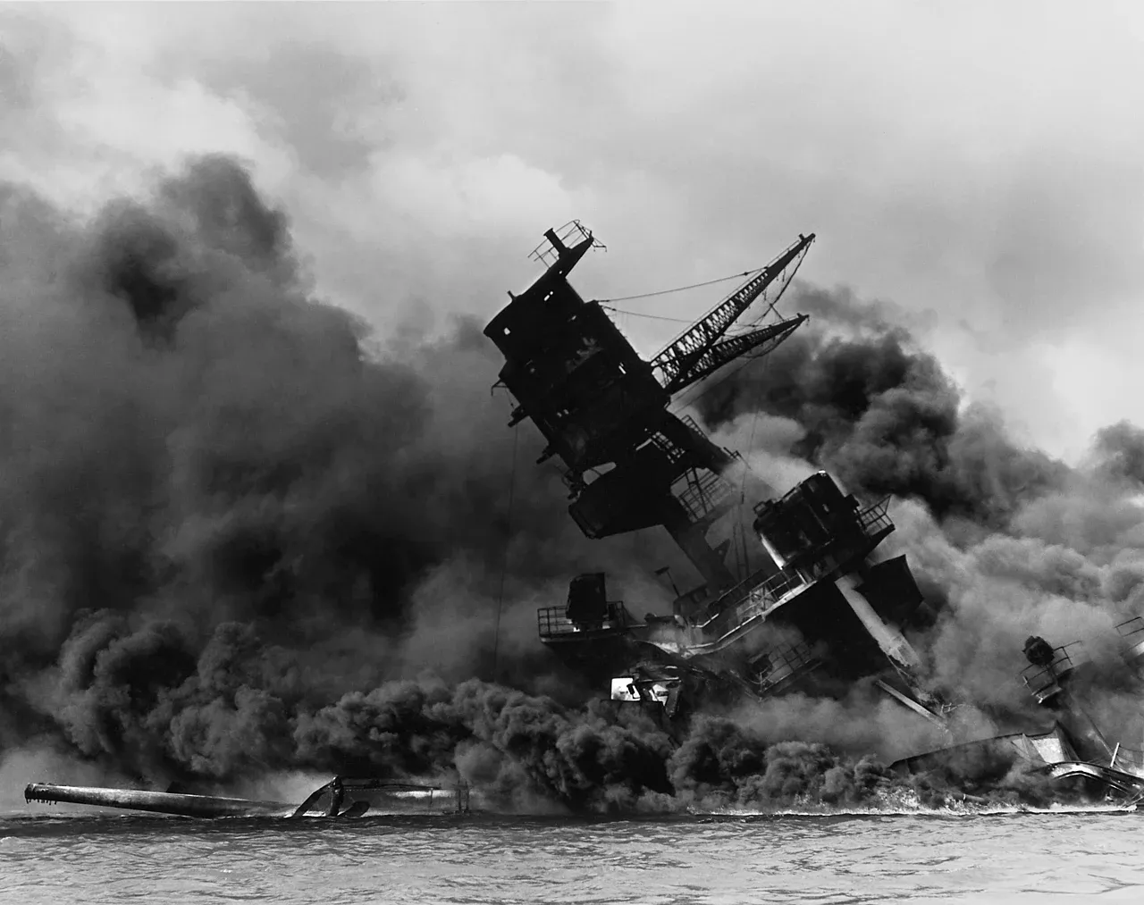 The USS Arizona (BB-39) burning after the Japanese attack on Pearl Harbor